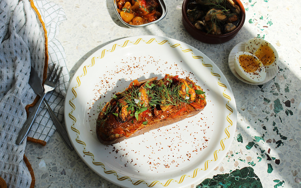 marinated mussels on chorizo toasts