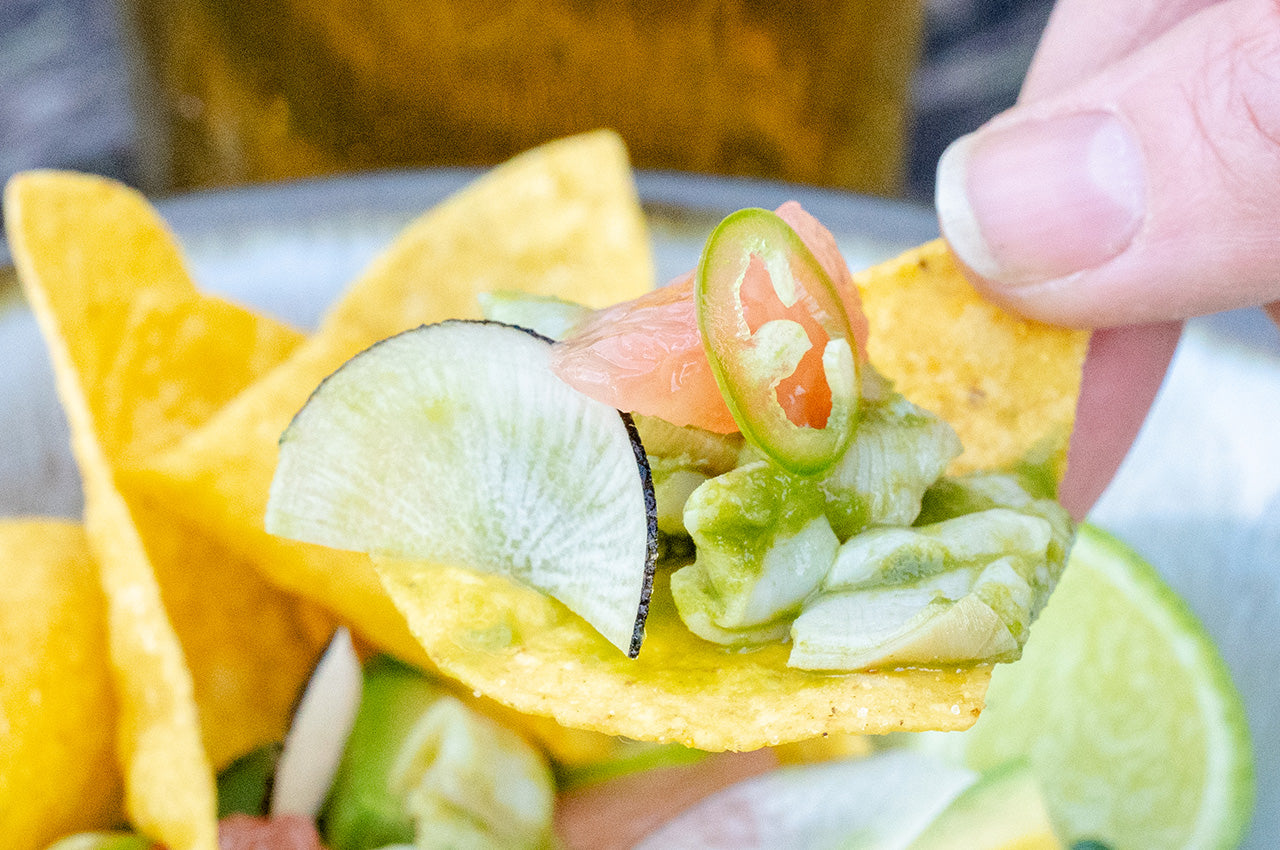 chip with ceviche on it